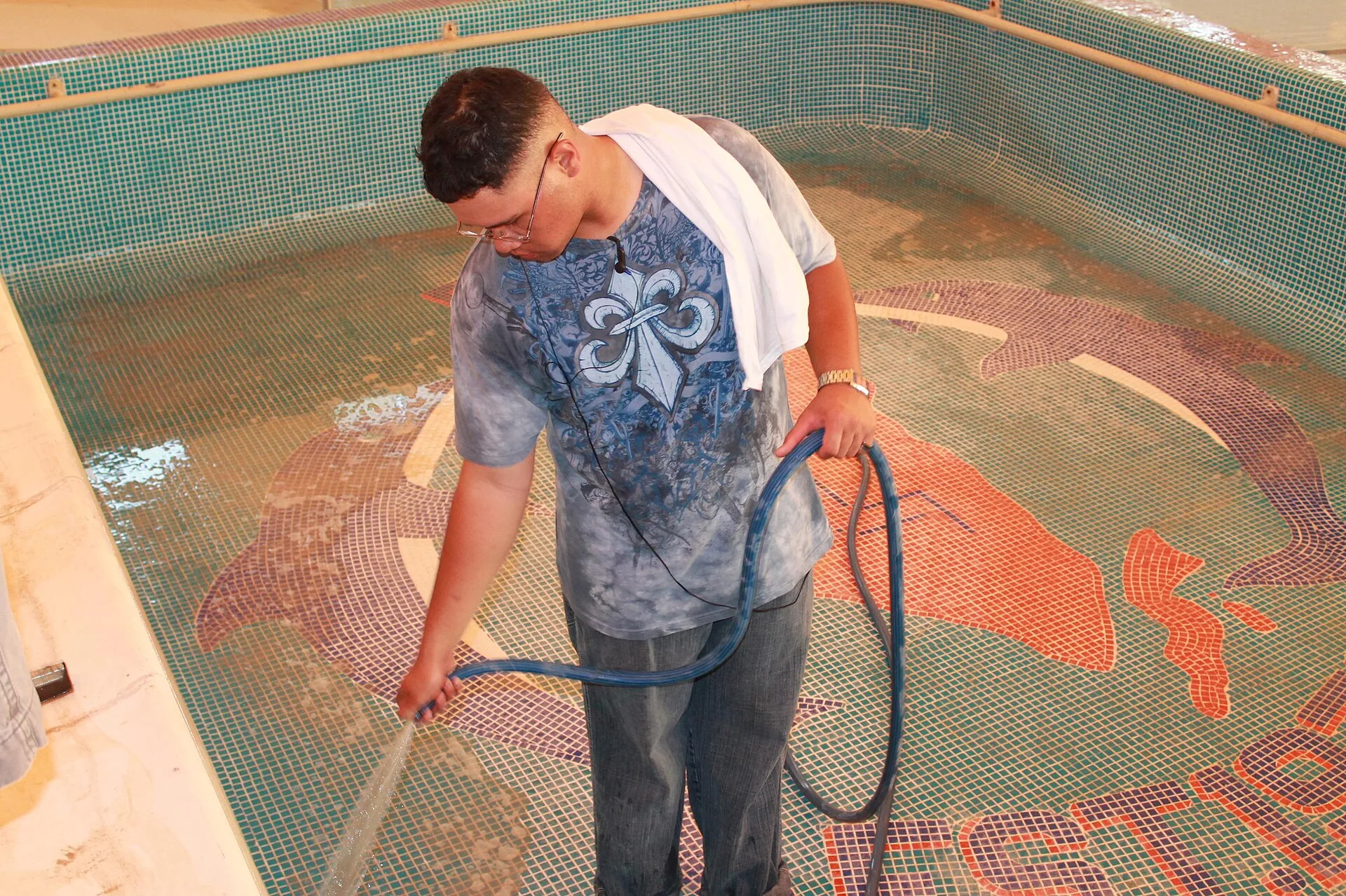 U.S. Navy Sonar Technician 2nd Class Nolan Kipi, assigned to the guided missile destroyer USS Higgins (DDG 76), hoses down a pool during a community relations event at the Bahrain Mobility International rehabilitation and recreation center in Manama, Bahrain, June 17, 2013. Sailors volunteered to do. Pool service package ideas: clear tiers and boundaries